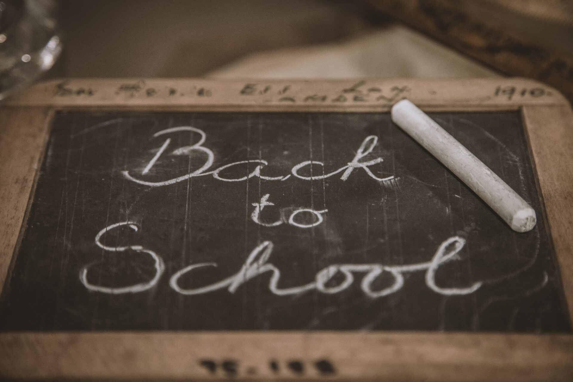 Wooden framed small blackboard with Back to School written on it in chalk
