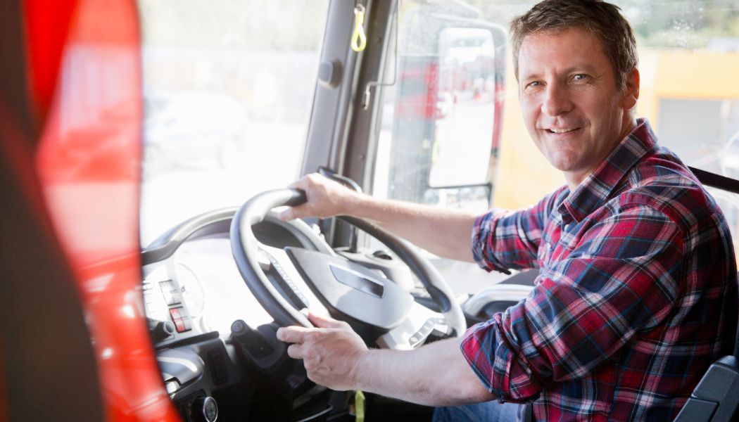 Man at the steering wheel of a lorry