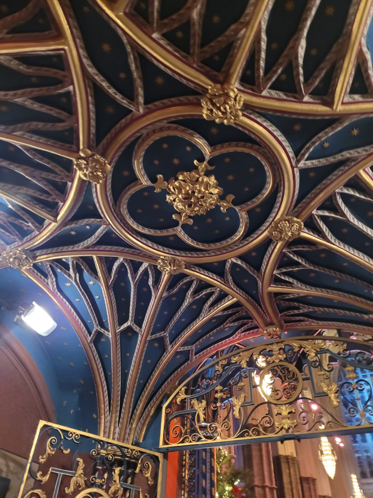 Ornate dark blue and gold carved ceiling at Westminster Abbey