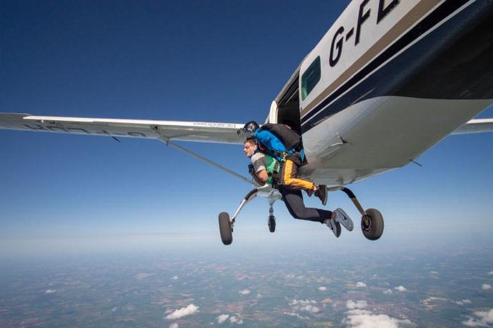 Sam jumping out of plane